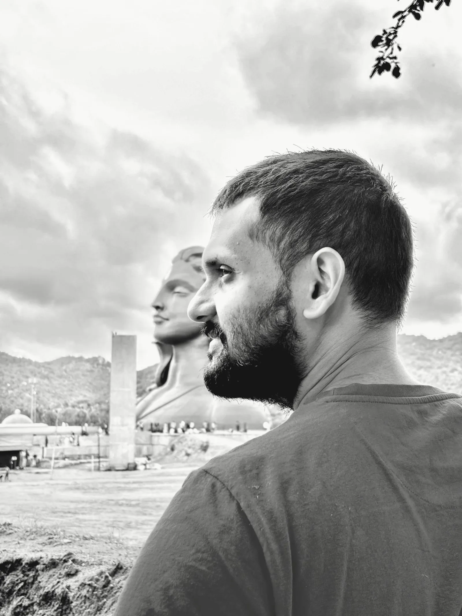 Black-and-white photo of Prasenjit Paul in profile before the Adiyogi statue