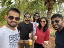 Chai with friends in a coconut grove
